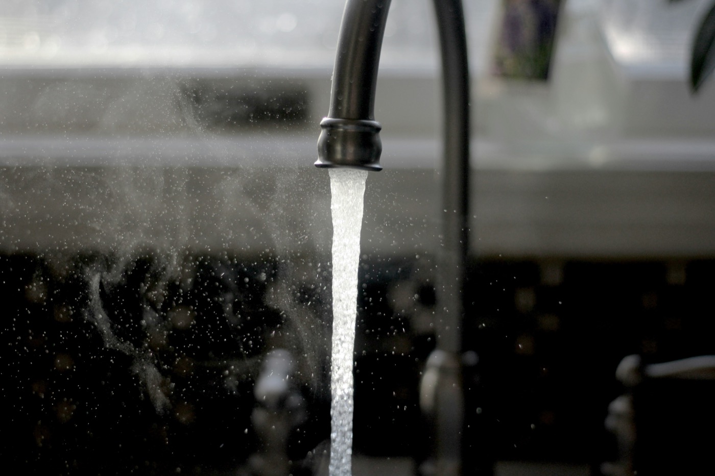 Water running from a tap for hot water service work