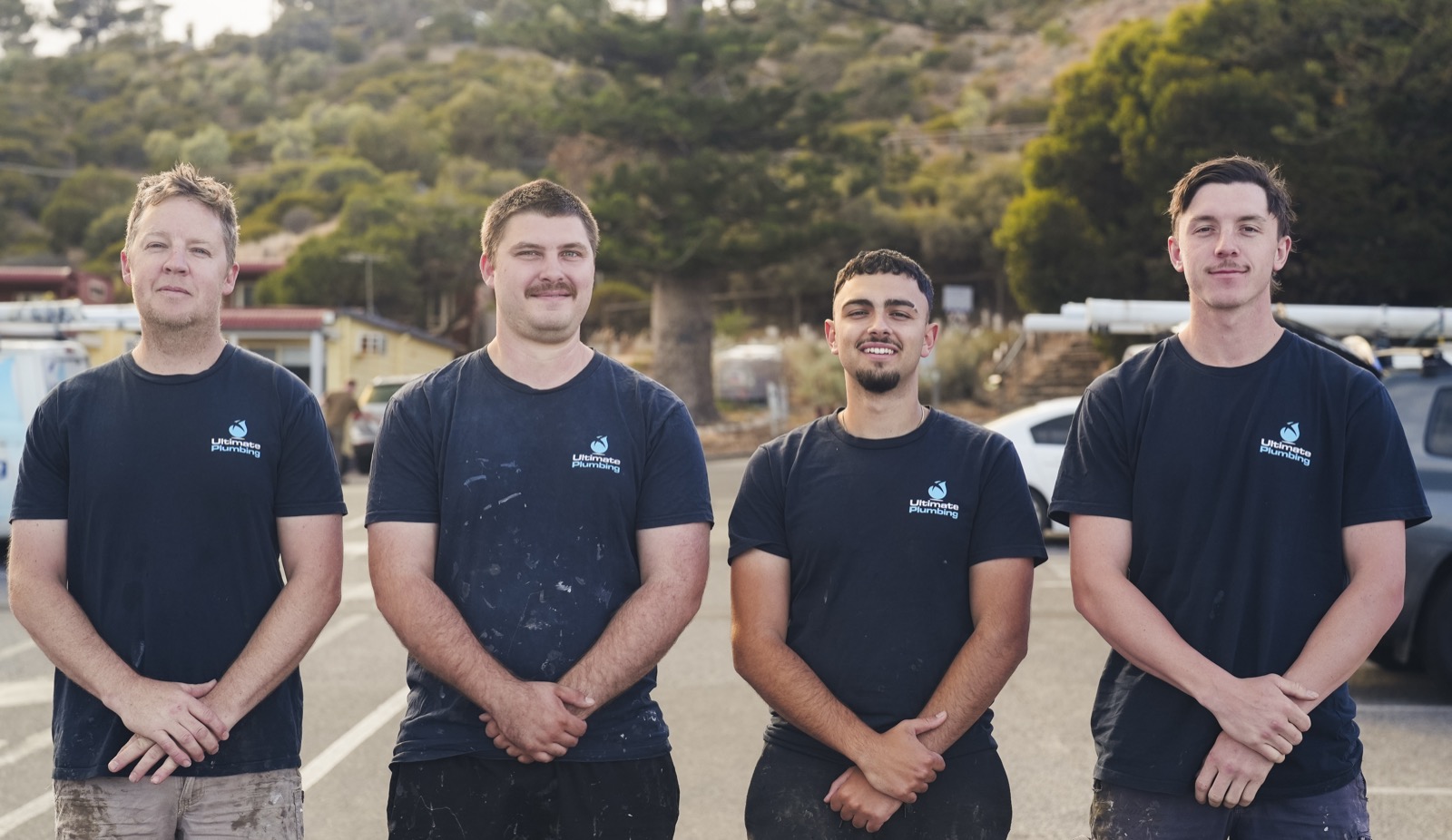 Ultimate Plumbing team members in branded workwear